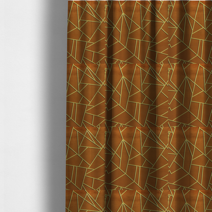 The fabric used to create these made-to-measure curtains is a luxurious brown or rust-coloured fabric featuring a fractured, geometric mosaic pattern. The warm, matte background is divided by a network of recessed gold metallic lines that form sharp, irregular polygons. This "cracked ice" or shattered-glass effect creates a bold, architectural look, blending the deep, earthy tones of the textile with shimmering, Art Deco-inspired accents.