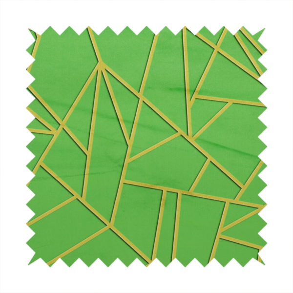A close-up of a vibrant bright green fabric featuring a fractured, geometric mosaic pattern. The lively, matte background is segmented by a network of recessed metallic gold lines that form sharp, irregular polygons. This "cracked ice" or shattered-glass effect creates a bold, modern look, combining a lush, verdant base with shimmering, Art Deco-inspired accents.