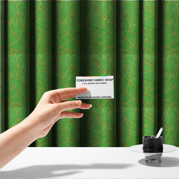 The fabric used to create these made-to-measure curtains is a vibrant bright green fabric featuring a fractured, geometric mosaic pattern. The lively, matte background is segmented by a network of recessed metallic gold lines that form sharp, irregular polygons. This "cracked ice" or shattered-glass effect creates a bold, modern look, combining a lush, verdant base with shimmering, Art Deco-inspired accents.