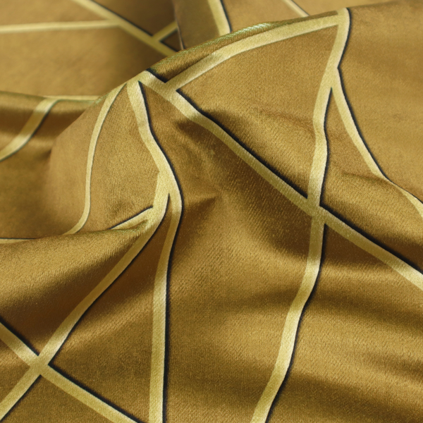 A close-up of a luxurious olive gold or antique brass-coloured fabric featuring a fractured, geometric mosaic pattern. The rich, matte background is segmented by a network of recessed tone-on-tone lines in a slightly lighter, shimmering shade. This "cracked ice" or shattered-glass effect creates a subtle, sophisticated 3D texture, blending mid-century modern influence with contemporary Art Deco elegance.