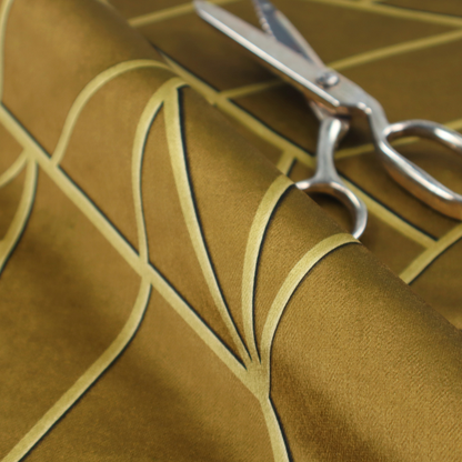 A close-up of a luxurious olive gold or antique brass-coloured fabric featuring a fractured, geometric mosaic pattern. The rich, matte background is segmented by a network of recessed tone-on-tone lines in a slightly lighter, shimmering shade. This "cracked ice" or shattered-glass effect creates a subtle, sophisticated 3D texture, blending mid-century modern influence with contemporary Art Deco elegance.