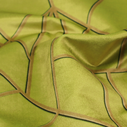 A close-up of a luxurious lime or chartreuse green fabric featuring a fractured, geometric mosaic pattern. The vibrant, matte background is segmented by a network of recessed metallic gold lines that form sharp, irregular polygons. This "shattered-glass" effect combines a high-energy, citrus-toned base with shimmering, Art Deco-inspired gold linework for a bold and architectural look.
