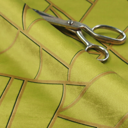 A close-up of a luxurious lime or chartreuse green fabric featuring a fractured, geometric mosaic pattern. The vibrant, matte background is segmented by a network of recessed metallic gold lines that form sharp, irregular polygons. This "shattered-glass" effect combines a high-energy, citrus-toned base with shimmering, Art Deco-inspired gold linework for a bold and architectural look.