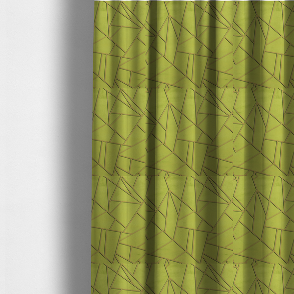 The fabric used to create these made-to-measure curtains is a luxurious lime or chartreuse green fabric featuring a fractured, geometric mosaic pattern. The vibrant, matte background is segmented by a network of recessed metallic gold lines that form sharp, irregular polygons. This "shattered-glass" effect combines a high-energy, citrus-toned base with shimmering, Art Deco-inspired gold linework for a bold and architectural look.