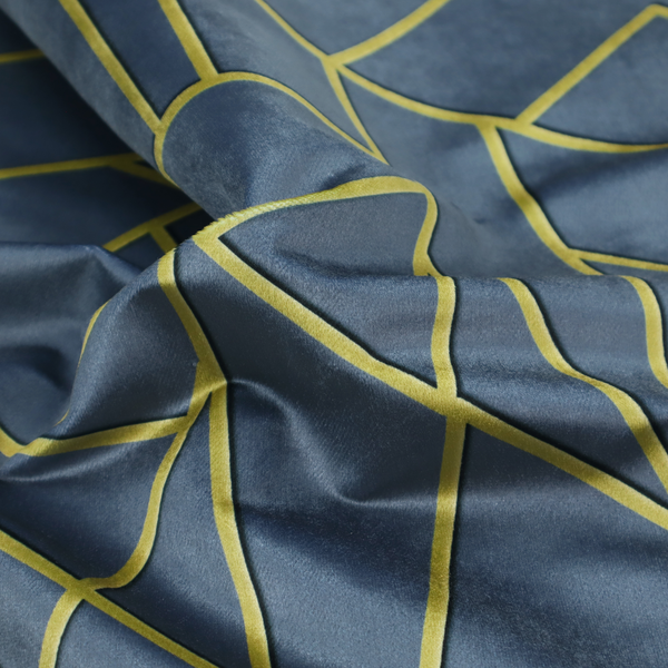 A close-up of a luxurious slate grey fabric featuring a fractured, geometric mosaic pattern. The deep, matte background is segmented by a network of recessed metallic gold lines that form sharp, irregular polygons. This "shattered-glass" effect creates a striking visual contrast, blending the cool, dark tones of the textile with shimmering, Art Deco-inspired accents for a modern, high-end look.