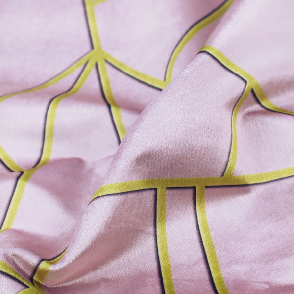 A close-up of a luxurious lavender or lilac fabric featuring a fractured, geometric mosaic pattern. The soft, matte background is segmented by a network of recessed metallic gold lines that form sharp, irregular polygons. This "shattered-glass" effect creates a sophisticated visual contrast, blending the delicate, feminine tones of the textile with shimmering, Art Deco-inspired gold accents for a clean and contemporary look.