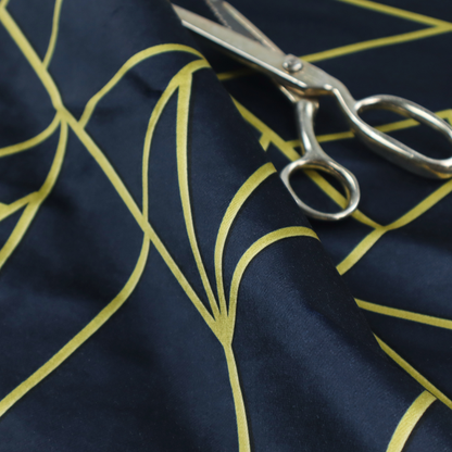 A close-up of a luxurious navy blue fabric featuring a fractured, geometric mosaic pattern. The dark, matte background is segmented by a network of recessed metallic gold lines that form sharp, irregular polygons. This "shattered-glass" or "cracked ice" effect creates a striking visual contrast, blending a deep, oceanic base with shimmering, Art Deco-inspired gold linework for a sophisticated, architectural look.