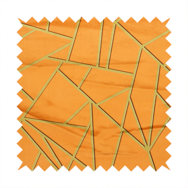A close-up of a luxurious bright orange or apricot fabric featuring a fractured, geometric mosaic pattern. The warm, vibrant background is segmented by a network of recessed metallic gold lines that form sharp, irregular polygons. This "shattered-glass" effect pairs a bold, citrus-toned base with shimmering, Art Deco-inspired gold linework, creating a high-contrast and architectural look with a subtle 3D texture.