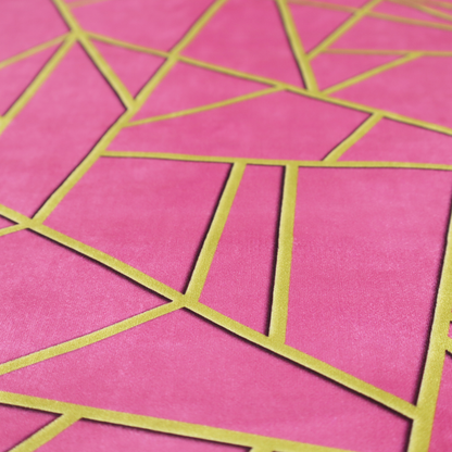 A close-up of a luxurious magenta or hot pink fabric featuring a fractured, geometric mosaic pattern. The vibrant, matte background is segmented by a network of recessed metallic gold lines that form sharp, irregular polygons. This "shattered-glass" effect creates a striking visual contrast, blending the intense, energetic pink base with shimmering, Art Deco-inspired gold linework for a modern and glamorous look.