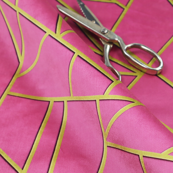A close-up of a luxurious magenta or hot pink fabric featuring a fractured, geometric mosaic pattern. The vibrant, matte background is segmented by a network of recessed metallic gold lines that form sharp, irregular polygons. This "shattered-glass" effect creates a striking visual contrast, blending the intense, energetic pink base with shimmering, Art Deco-inspired gold linework for a modern and glamorous look.