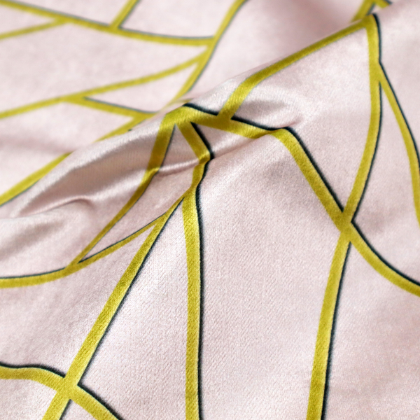 A close-up of a luxurious blush pink or pale rose fabric featuring a fractured, geometric mosaic pattern. The soft, matte background is segmented by a network of recessed metallic gold lines that form sharp, irregular polygons. This "shattered-glass" effect creates a refined visual contrast, blending the subtle, romantic tones of the textile with shimmering, Art Deco-inspired gold accents for a clean and sophisticated look.