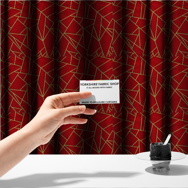 The fabric used to create these made-to-measure curtains is a luxurious vibrant red fabric featuring a fractured, geometric mosaic pattern. The rich, matte background is segmented by a network of recessed metallic gold lines that form sharp, irregular polygons. This "shattered-glass" or "cracked ice" effect creates a striking visual contrast, blending the intense red base with shimmering, Art Deco-inspired gold linework for a dramatic and architectural look.