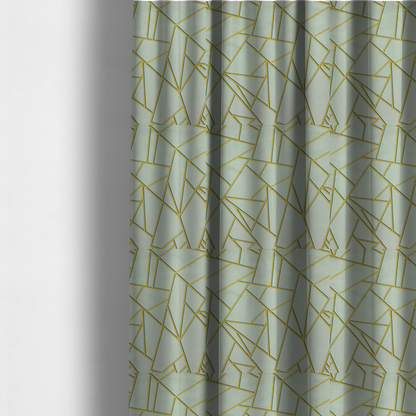 The fabric used to create these made-to-measure curtains is a luxurious silver fabric featuring a fractured, geometric mosaic pattern. The soft, matte background is segmented by a network of recessed metallic gold lines that form sharp, irregular polygons. This "shattered-glass" effect creates a calm yet architectural look, blending cool, desaturated tones with shimmering, Art Deco-inspired gold linework for a high-end, contemporary finish.