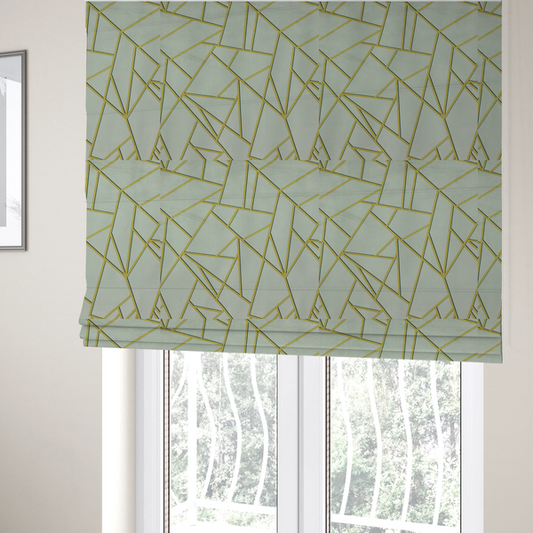 The fabric used to create these Roman blinds is a luxurious silver fabric featuring a fractured, geometric mosaic pattern. The soft, matte background is segmented by a network of recessed metallic gold lines that form sharp, irregular polygons. This "shattered-glass" effect creates a calm yet architectural look, blending cool, desaturated tones with shimmering, Art Deco-inspired gold linework for a high-end, contemporary finish.