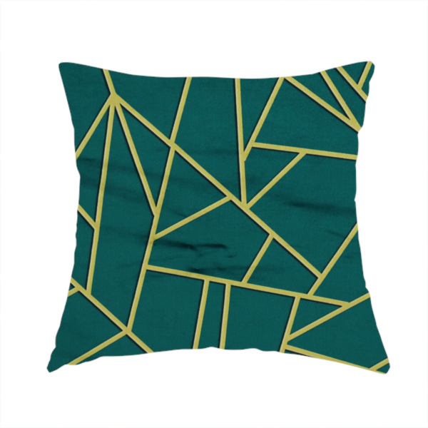 The fabric used to create this handmade cushion is a luxurious deep peacock or dark teal fabric featuring a fractured, geometric mosaic pattern. The moody, matte background is segmented by a network of recessed metallic gold lines that form sharp, irregular polygons. This "shattered-glass" effect pairs a sophisticated, dark jewel-toned base with shimmering, Art Deco-inspired gold accents for a dramatic and architectural look.