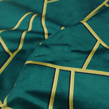 A close-up of a luxurious deep peacock or dark teal fabric featuring a fractured, geometric mosaic pattern. The moody, matte background is segmented by a network of recessed metallic gold lines that form sharp, irregular polygons. This "shattered-glass" effect pairs a sophisticated, dark jewel-toned base with shimmering, Art Deco-inspired gold accents for a dramatic and architectural look.