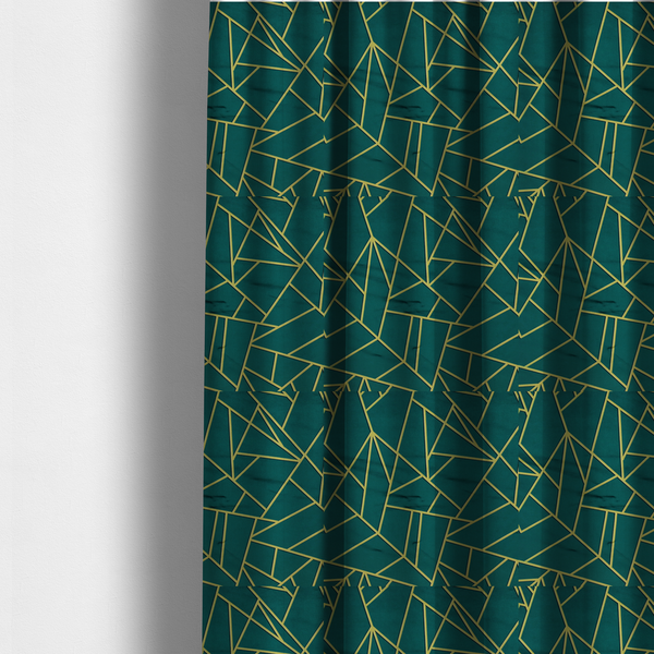 The fabric used to create these made-to-measure curtains is a luxurious deep peacock or dark teal fabric featuring a fractured, geometric mosaic pattern. The moody, matte background is segmented by a network of recessed metallic gold lines that form sharp, irregular polygons. This "shattered-glass" effect pairs a sophisticated, dark jewel-toned base with shimmering, Art Deco-inspired gold accents for a dramatic and architectural look.