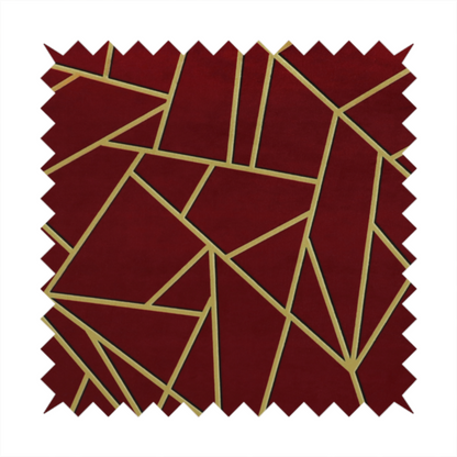 A close-up of a luxurious burgundy or wine red fabric featuring a fractured, geometric mosaic pattern. The dark, velvety matte background is segmented by a network of recessed metallic gold lines that form sharp, irregular polygons. This "shattered-glass" effect pairs a rich, deep-toned base with shimmering, Art Deco-inspired gold linework for a dramatic and architectural look.