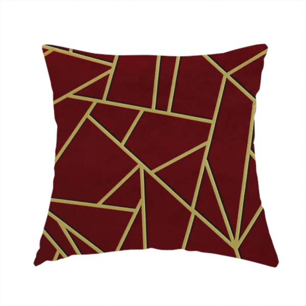 The fabric used to create this handmade cushion is a luxurious burgundy or wine red fabric featuring a fractured, geometric mosaic pattern. The dark, velvety matte background is segmented by a network of recessed metallic gold lines that form sharp, irregular polygons. This "shattered-glass" effect pairs a rich, deep-toned base with shimmering, Art Deco-inspired gold linework for a dramatic and architectural look.