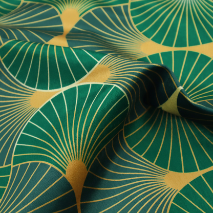 This fabric features a sophisticated Art Deco fan pattern in a moodier, more saturated colour palette than the previous version. The interlocking scallop design creates a dense, elegant texture suitable for high-end decor.