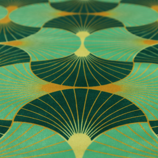 The DP-383-1 fabric features a sophisticated Art Deco design characterized by an interlocking scalloped fan motif that creates a rhythmic, geometric aesthetic. The pattern utilizes a balanced, tri-colour palette consisting of deep forest green for structured contrast, soft sage for a fresh and contemporary feel, and bright ochre to highlight the radiating lines and focal points.