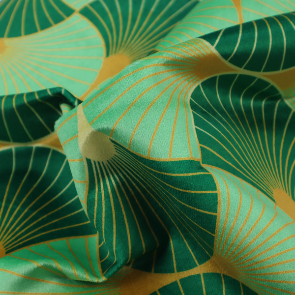 The DP-383-1 fabric features a sophisticated Art Deco design characterized by an interlocking scalloped fan motif that creates a rhythmic, geometric aesthetic. The pattern utilizes a balanced, tri-colour palette consisting of deep forest green for structured contrast, soft sage for a fresh and contemporary feel, and bright ochre to highlight the radiating lines and focal points.