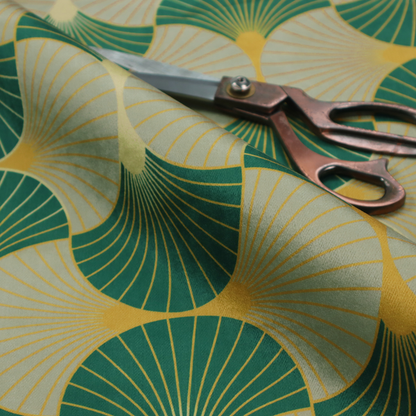 The DP-385-1 fabric presents a sophisticated Art Deco aesthetic featuring an interlocking scalloped fan motif that creates a rhythmic, architectural symmetry across the textile. This specific variation utilizes a refined colour palette of deep emerald green, cool slate grey, and warm ochre. The pattern is composed of alternating shells where thin lines radiate from golden central points, set against a subtle cream background that peeks through at the base of each fan.