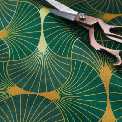 The DP-386-1 fabric showcases a classic Art Deco aesthetic with a repeating, interlocking scalloped fan motif that creates a rhythmic "fish scale" layout. This design features a rich, dual-tone colour scheme of deep emerald green and saturated teal, accented by thin, radiating lines in bright ochre. The symmetrical arrangement of the fans, coupled with the jewel-toned palette, evokes a sense of 1920s luxury and architectural elegance, making it a bold statement piece for sophisticated interior decor.