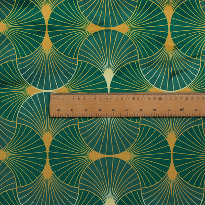 The DP-386-1 fabric showcases a classic Art Deco aesthetic with a repeating, interlocking scalloped fan motif that creates a rhythmic "fish scale" layout. This design features a rich, dual-tone colour scheme of deep emerald green and saturated teal, accented by thin, radiating lines in bright ochre. The symmetrical arrangement of the fans, coupled with the jewel-toned palette, evokes a sense of 1920s luxury and architectural elegance, making it a bold statement piece for sophisticated interior decor.