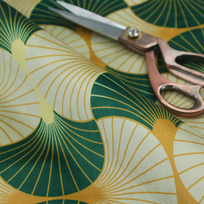 This fabric features a cohesive Art Deco-inspired print, showcasing a rhythmic, interlocking scalloped fan motif that evokes the architectural elegance of the 1920s. Each variation uses a "fish scale" layout with thin lines radiating from golden-orange focal points, but offers a distinct mood through its specific colour story.