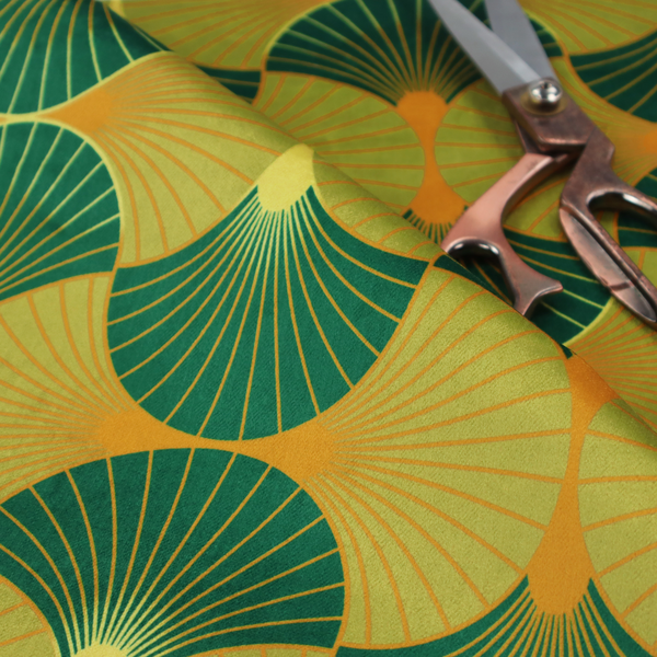 The DP-393-1 fabric features a vibrant and energetic take on the classic Art Deco fan motif, characterized by a citrus-inspired colour palette.