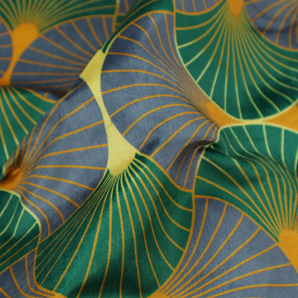 The DP-394-1 fabric features a sophisticated Art Deco aesthetic, characterized by an interlocking scalloped fan motif that creates a rhythmic "fish scale" layout across the textile.