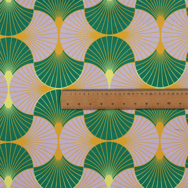 The DP-395-1 fabric features an elegant and playful Art Deco aesthetic, characterized by its interlocking scalloped fan motif and a unique, soft colour palette.