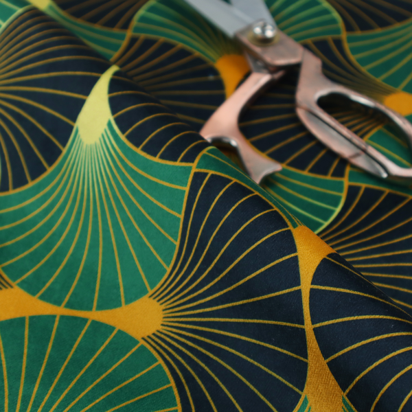 The DP-396-1 fabric features a striking and formal Art Deco aesthetic, characterized by its rhythmic, interlocking scalloped fan motif. This specific variation utilizes a high-contrast, jewel-toned colour palette that emphasizes geometric depth.