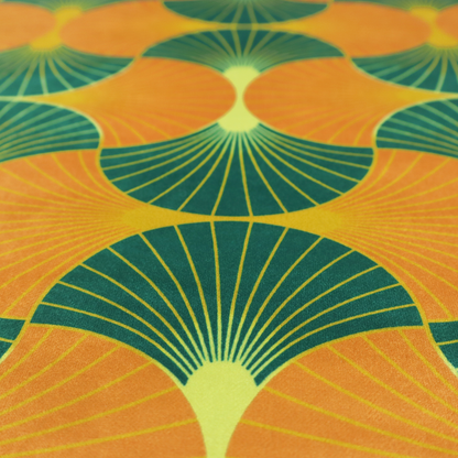 The DP-397-1 fabric showcases a vibrant and warm Art Deco aesthetic, featuring a rhythmic, interlocking scalloped fan motif in a "fish scale" arrangement. This specific colourway utilizes a bold, high-contrast palette of deep forest green and saturated orange fans.
