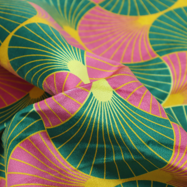 The DP-398-1 fabric features a bold and high-energy Art Deco aesthetic, characterized by its signature interlocking scalloped fan motif in a vibrant, modern colourway.