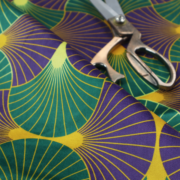 The DP-399-1 fabric features a regal and high-contrast Art Deco aesthetic, characterized by its rhythmic, interlocking scalloped fan motif in a "fish scale" layout. This specific colourway utilizes a bold and sophisticated palette.