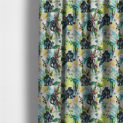 The fabric used to create these made-to-measure curtains is a vibrant tropical fabric print featuring sleek black panthers prowling among exotic flora. The design includes colourful botanical elements like oversized teal and lime green leaves, magenta flowers, and yellow ferns. Small details like a soaring owl and a hummingbird are scattered throughout on a pale grey background.
