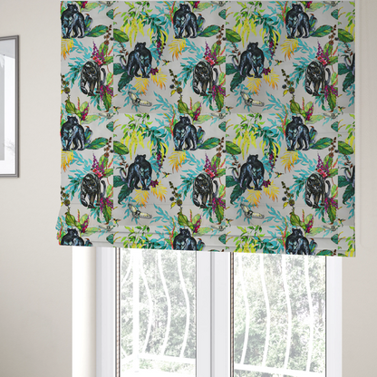 The fabric used to create these Roman blinds is a vibrant tropical fabric print featuring sleek black panthers prowling among exotic flora. The design includes colourful botanical elements like oversized teal and lime green leaves, magenta flowers, and yellow ferns. Small details like a soaring owl and a hummingbird are scattered throughout on a pale grey background.