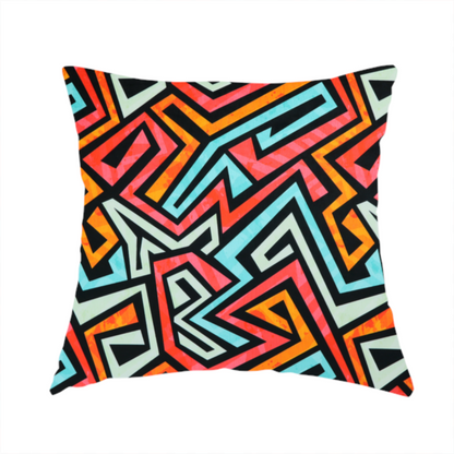 The fabric used to create this handmade cushion is a bold, abstract geometric pattern with a vibrant, interlocking maze-like design.