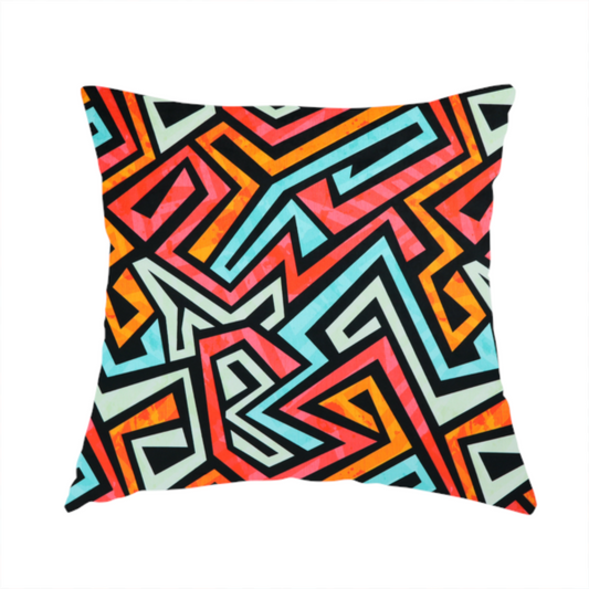 The fabric used to create this handmade cushion is a bold, abstract geometric pattern with a vibrant, interlocking maze-like design.