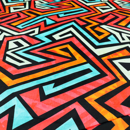 A bold, abstract geometric pattern with a vibrant, interlocking maze-like design.