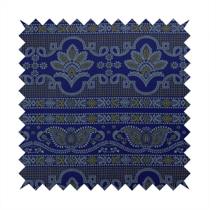 Intricate royal blue and yellow fabric featuring traditional ornate damask and paisley motifs arranged in horizontal decorative bands.