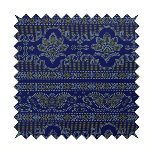 Intricate royal blue and yellow fabric featuring traditional ornate damask and paisley motifs arranged in horizontal decorative bands.