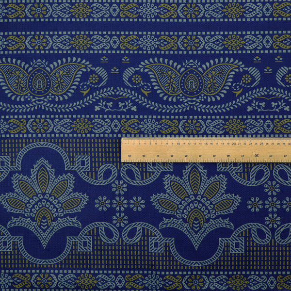 Intricate royal blue and yellow fabric featuring traditional ornate damask and paisley motifs arranged in horizontal decorative bands.