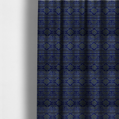 The fabric used to create these made-to-measure curtains has an intricate royal blue and yellow fabric featuring traditional ornate damask and paisley motifs arranged in horizontal decorative bands.