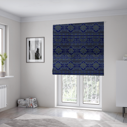 The fabric used to create these Roman blinds is an intricate royal blue and yellow fabric featuring traditional ornate damask and paisley motifs arranged in horizontal decorative bands.
