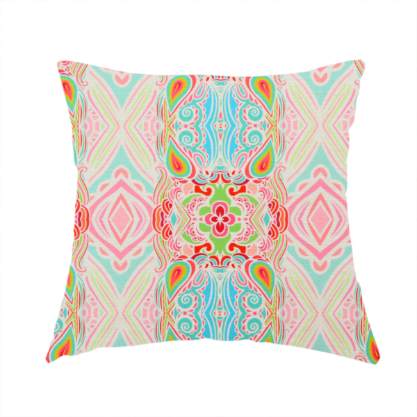 The fabric used to create this handmade cushion is a vibrant, repeating pattern featuring abstract botanical shapes, paisley motifs, and floral elements in bright shades of pink, turquoise blue, lime green, and orange.