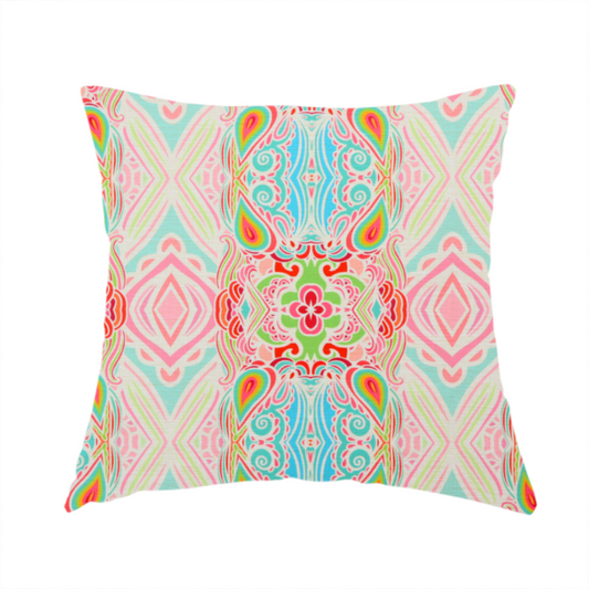 The fabric used to create this handmade cushion is a vibrant, repeating pattern featuring abstract botanical shapes, paisley motifs, and floral elements in bright shades of pink, turquoise blue, lime green, and orange.