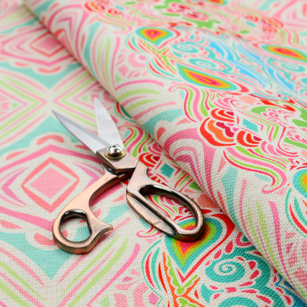 Vibrant, repeating pattern featuring abstract botanical shapes, paisley motifs, and floral elements in bright shades of pink, turquoise blue, lime green, and orange.